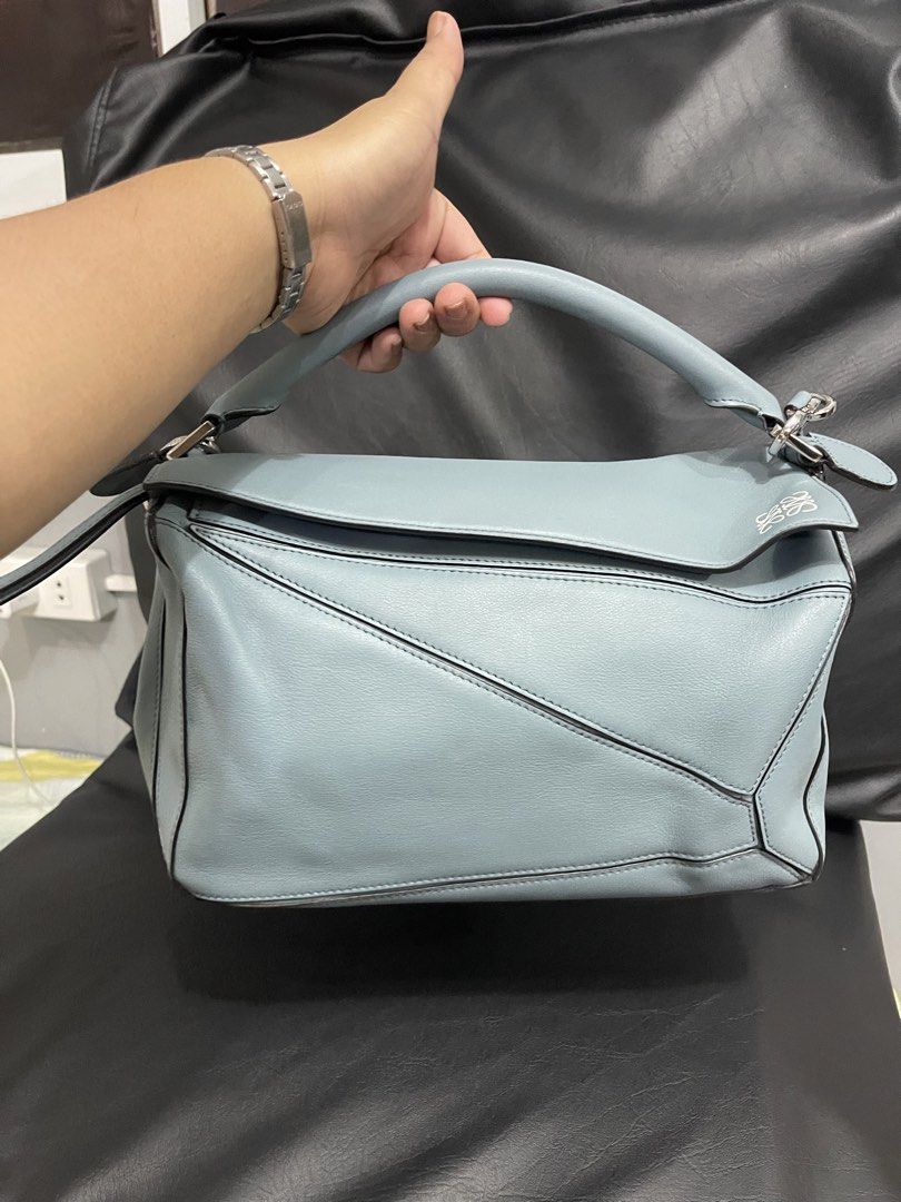 Loewe Hammock Bag Light Blue Leather (Category: Luxury Bags & Wallets) located in Lupao. Submitted by jennylynda42204 (Listing ID 1448621311, Image 2). Description: - Loewe Hammock Bag - Color: Light Blue - Material: Soft Leather - Interior: Herringbone lining with a small pocket - Closure: Zipper - Hardware: Silver-toned - Ideal for: Everyday use.