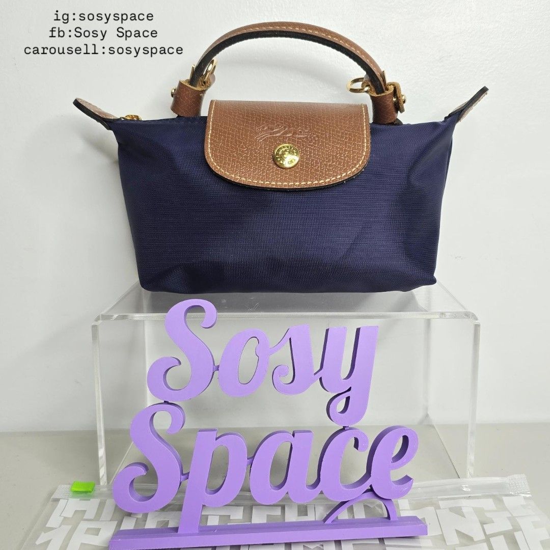 Longchamp Le Pliage Original Pouch With Handle And Sling Strap (Category: Luxury Bags & Wallets) located in Lucena. Submitted by sosyspace (Listing ID 1452905239, Image 2). Description: L. O. N. G. C. H. A. M. P. 04B2P77 Le Pliage Pouch w/ Handle and Sling Strap 34175089556 Navy 6.7 x 2.2 x 4.3 inches Recycled Polyamide Canvas W/ Inside Coating Russian Cowhide Leather Gold Hardware Snap Button and Zip Closure France Condition: Brand New Final Pri