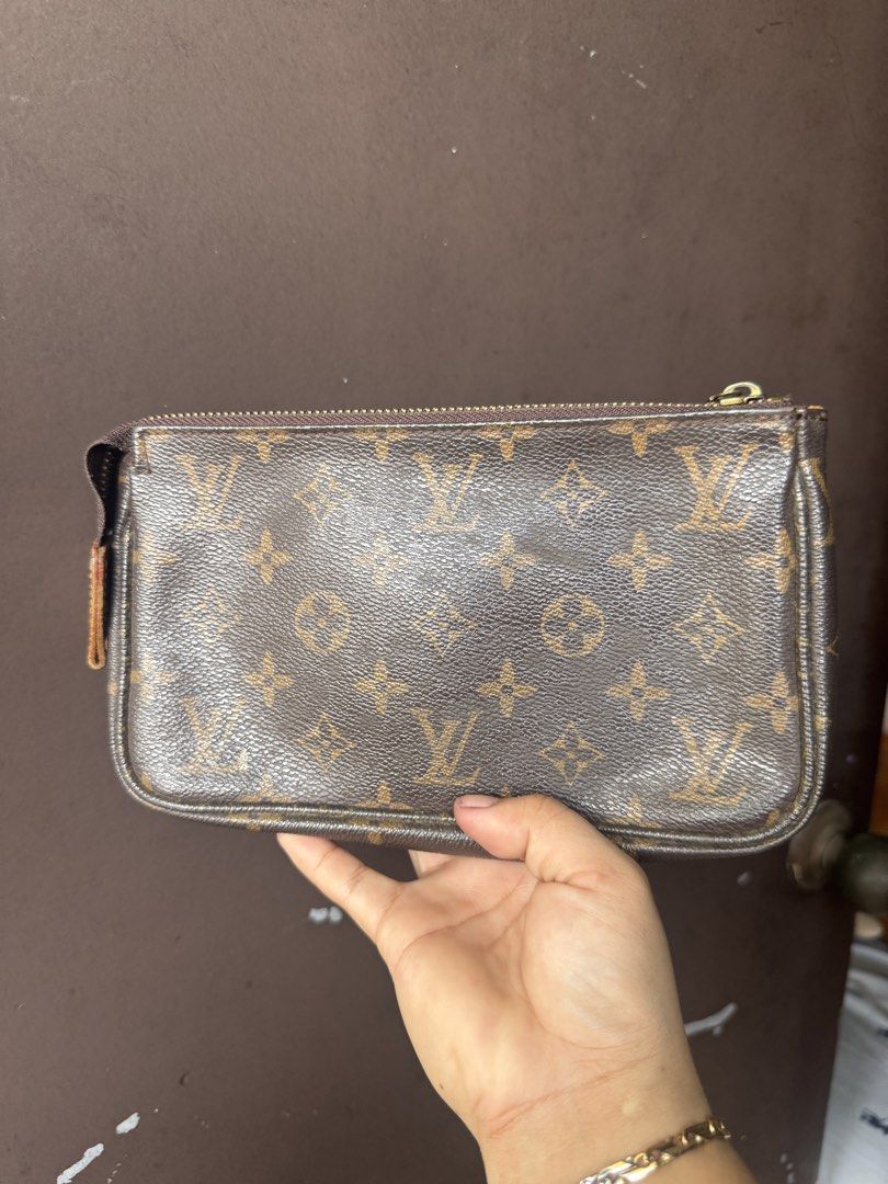 Louis Vuitton Monogram Pouch (Category: Luxury Bags & Wallets) located in Cainta. Submitted by danica010314 (Listing ID 1453006356, Image 1). Description: - Authentic Louis Vuitton Pouch - Classic Monogram Canvas - Zipper Closure - Brown Fabric Interior - Ideal for organizing essentials or as a clutch - Made in France - Minor signs of wear inside.