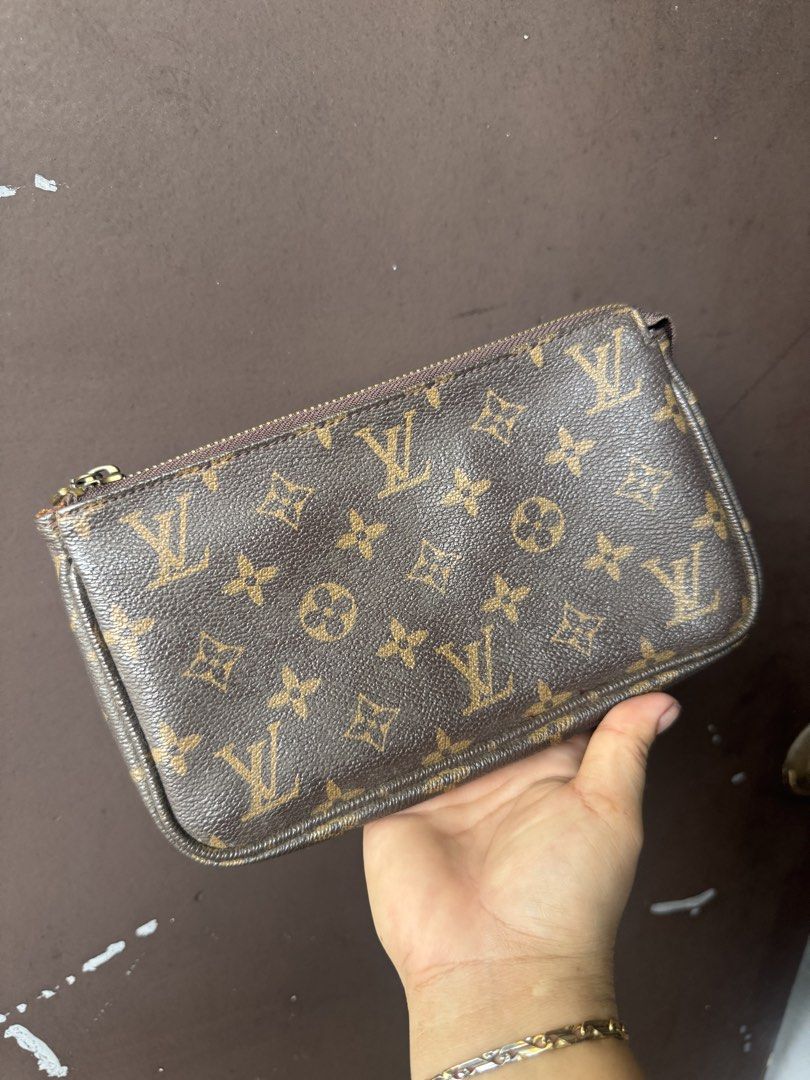 Louis Vuitton Monogram Pouch (Category: Luxury Bags & Wallets) located in Cainta. Submitted by danica010314 (Listing ID 1453006356, Image 2). Description: - Authentic Louis Vuitton Pouch - Classic Monogram Canvas - Zipper Closure - Brown Fabric Interior - Ideal for organizing essentials or as a clutch - Made in France - Minor signs of wear inside.