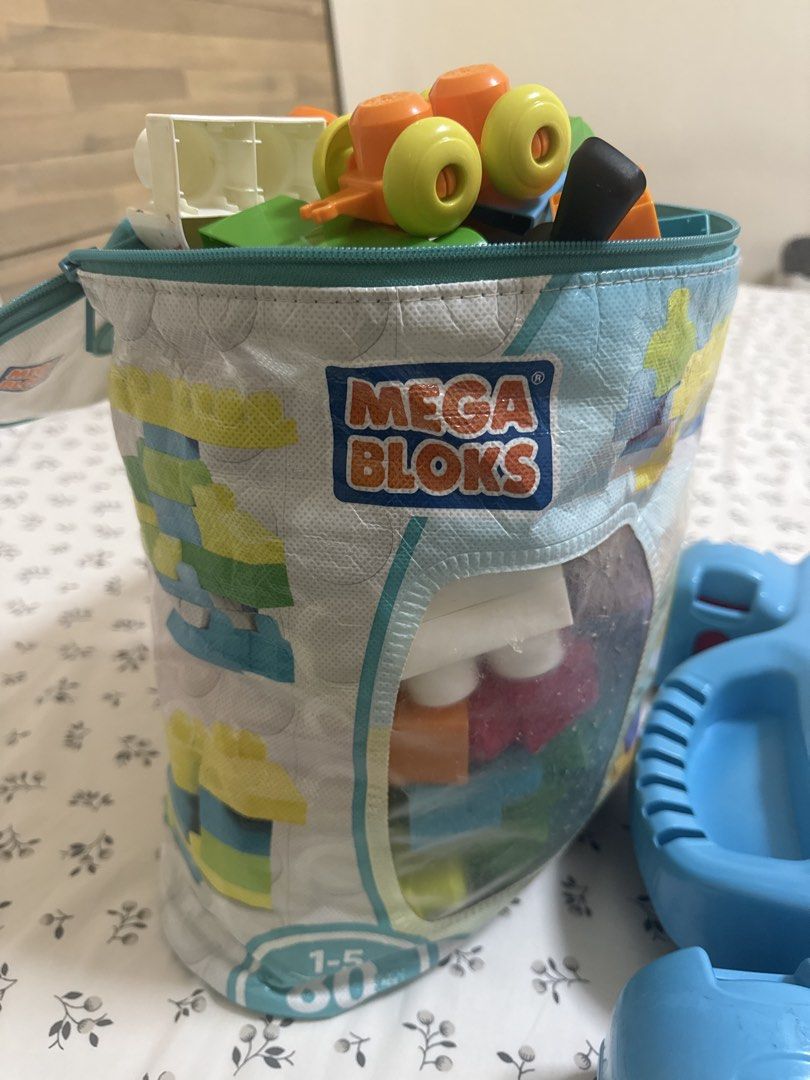 Mega blocks (Category: Lego & Building Sets) located in Singapore. Submitted by ksoni (Listing ID 1452885279, Image 3). Description: Mega blocks table and a bag of extra mega blocks to show more creativity .