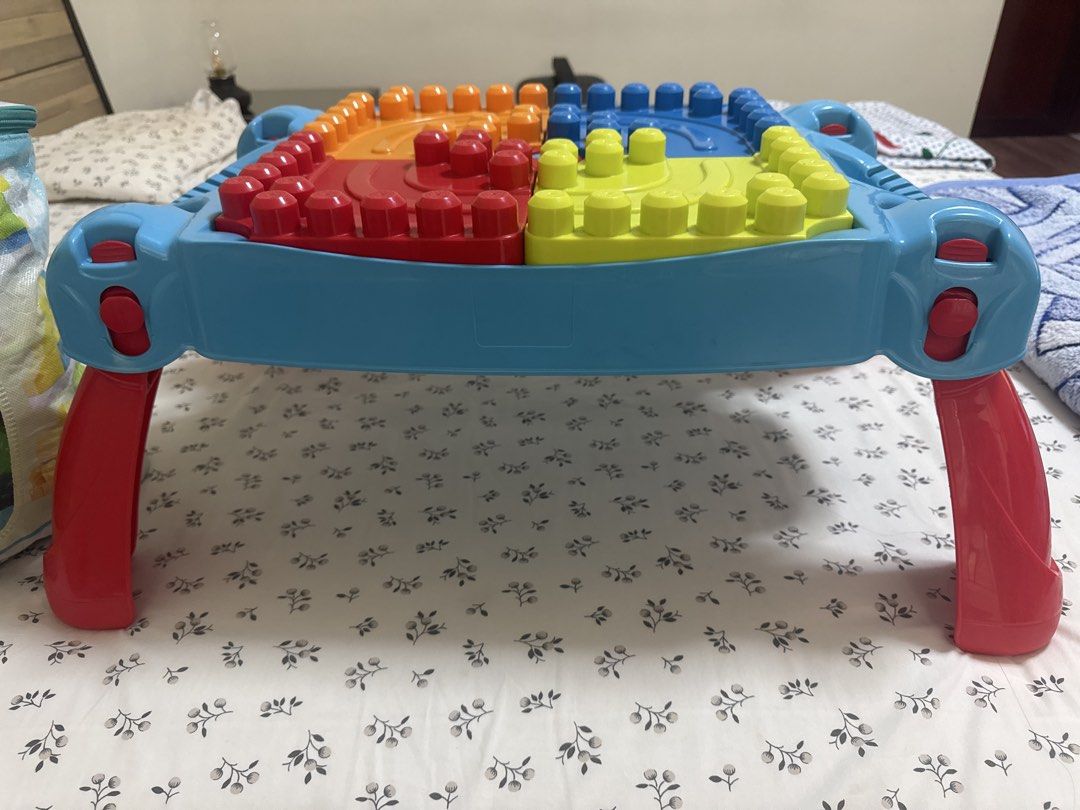 Mega blocks (Category: Lego & Building Sets) located in Singapore. Submitted by ksoni (Listing ID 1452885279, Image 4). Description: Mega blocks table and a bag of extra mega blocks to show more creativity .