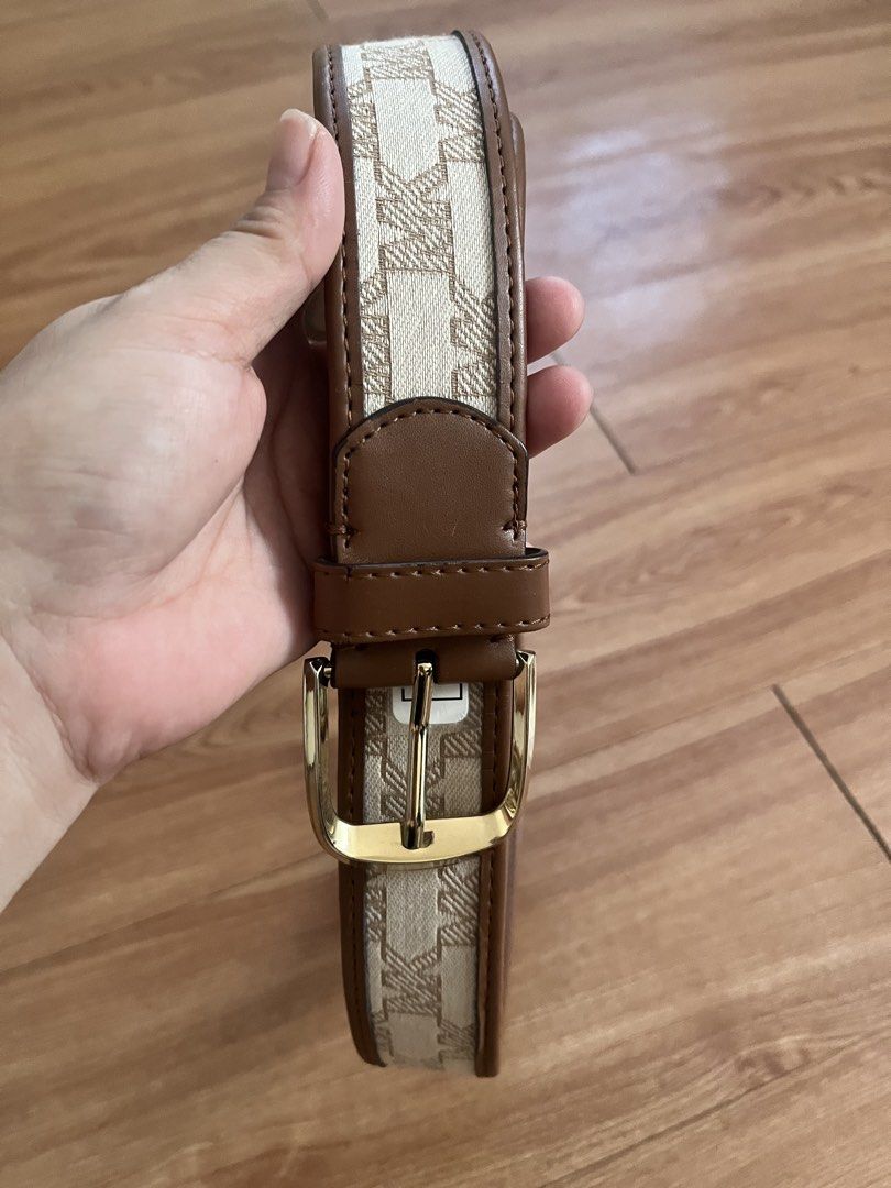 Michael Kors Belt - MK Monogram Canvas & Leather (Category: Belts) located in San Pablo. Submitted by celgvr (Listing ID 1453048125, Image 2). Description: - Authentic MK monogram belt - Classic brown and beige colorway - Elegant gold buckle - Genuine leather trim - Versatile accessory to elevate any outfit.