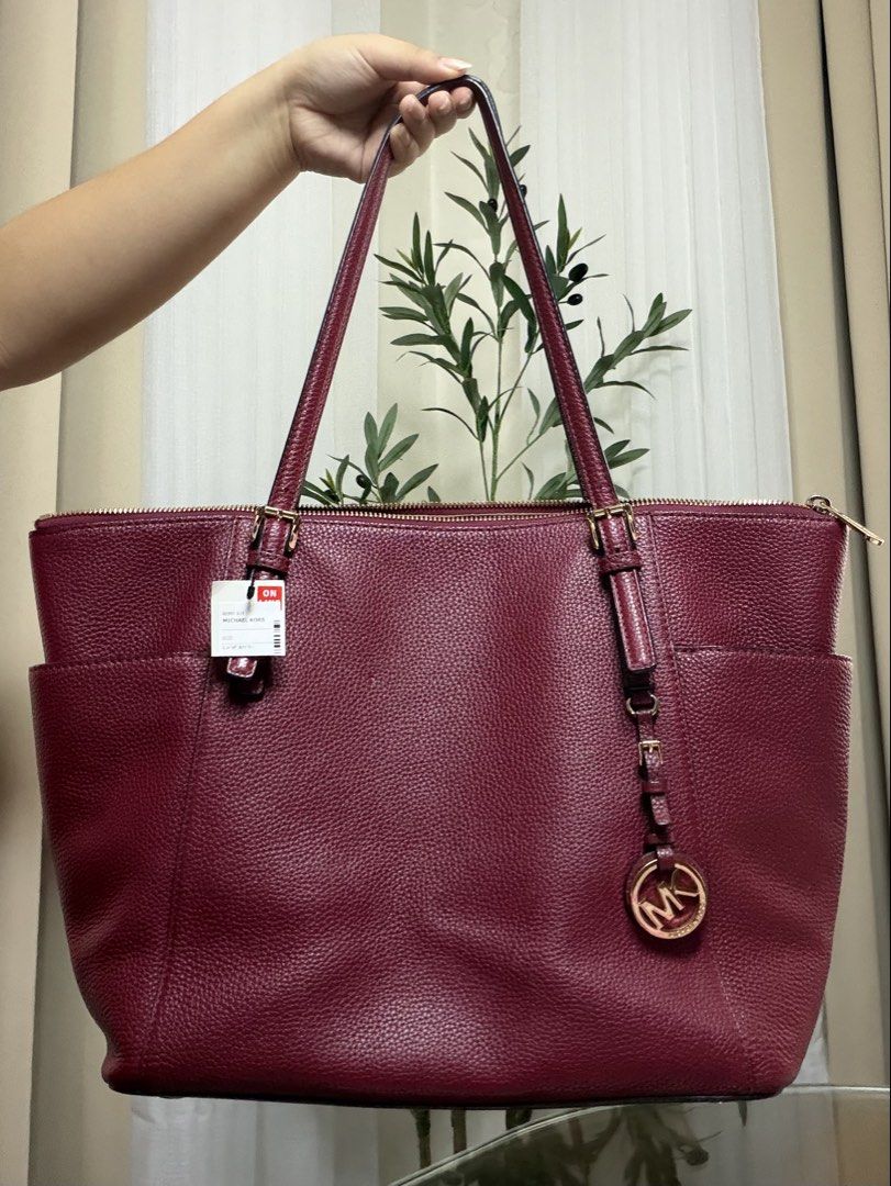 Michael Kors Charlotte Large Tote Bag (Dark Cherry) (Category: Tote Bags) located in Paranaque City. Submitted by bbubbi (Listing ID 1452929330, Image 1). Description: — price is negotiable. — burgundy pebbled leather tote bag, 9/10 condition. — gold-tone hardware, multiple interior pockets for organization, includes iconic Michael Kors charm. — quiet luxury. could fit a 15.6inch laptop. — 2nd hand bag from Japan. 💵 mop: gcash / gotyme 📦 mod: l
