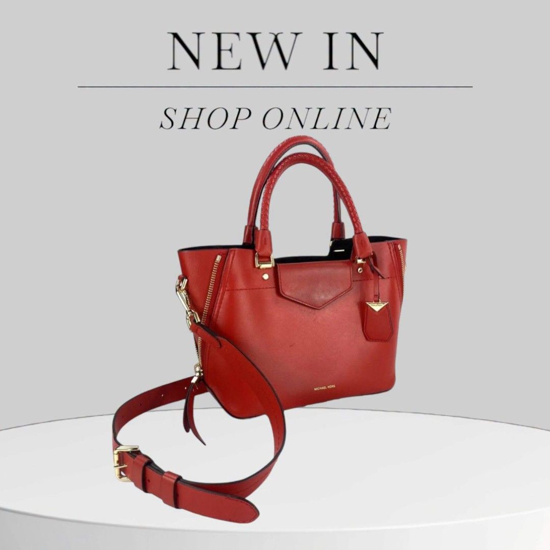 Michael Kors Red Leather Satchel Handbag (Category: Luxury Bags & Wallets) located in Baguio. Submitted by msgold2601 (Listing ID 1453048886, Image 1). Description: - Authentic Michael Kors red leather satchel - Elegant gold hardware details - Includes a detachable shoulder strap for versatile carrying - Secure top zip closure - Stylish braided top handles - Ample interior space for your essentials - Ideal for both everyday use and evening outing
