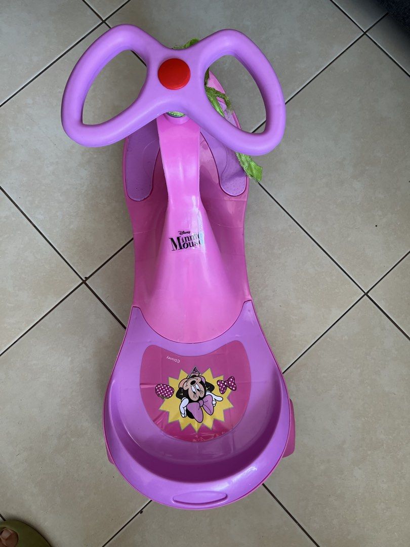 Minnie Mouse swing car (Category: Infant Playtime) located in Mandaluyong City. Submitted by prelovedbyshayne (Listing ID 1452932621, Image 3). Description: - Fun pink Minnie Mouse swing car for toddlers - Easy to ride: just twist the steering wheel - Suitable forindoor and outdoor play - Minor scuffs from normal use, but fully functional - Perfect for little Disney fans! - Price:550+sf - MOP: BDO/Gcash/GotyMe/Maribank - Location: Mandaluyong - R