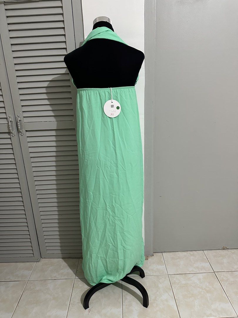 Mint Green Halter Neck Maxi Dress (Category: Dresses) located in Balanga. Submitted by ruffa_assorted_item (Listing ID 1452890457, Image 2). Description: - Long mint green maxi dress - Halter neck with a square neckline - Made from lightweight fabric - Perfect for casual outings or beach days - Easy to wear and comfortable.