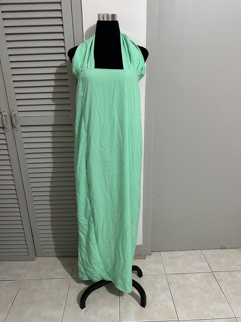 Mint Green Halter Neck Maxi Dress (Category: Dresses) located in Balanga. Submitted by ruffa_assorted_item (Listing ID 1452890457, Image 1). Description: - Long mint green maxi dress - Halter neck with a square neckline - Made from lightweight fabric - Perfect for casual outings or beach days - Easy to wear and comfortable.
