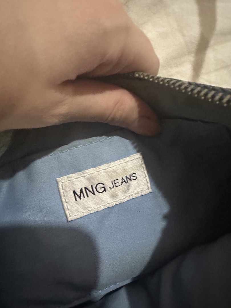 MNG Jeans Denim Graffiti Shoulder Bag (Category: Shoulder Bags) located in Manila. Submitted by jiggaboo6767 (Listing ID 1453033472, Image 3). Description: - Cute MNG Jeans denim shoulder bag - Features a cool graffiti print - Tan leather strap and trim - Secure zipper closure - Includes an inner pocket - Ideal for everyday wear.