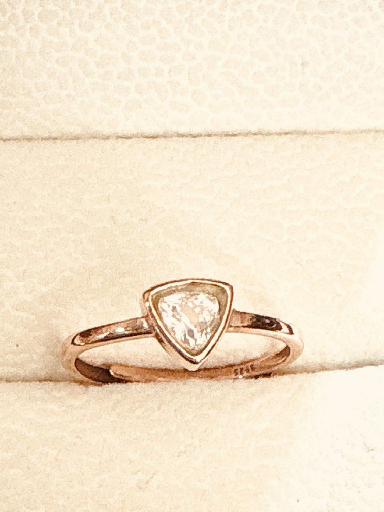 Moonstone Ring (Category: Rings) located in Singapore. Submitted by Discoverme (Listing ID 1452940893, Image 1). Description: ✨ Natural Rainbow Moonstone adjustable Ring Elegant triangle-cut moonstone featuring a beautiful blue-purple shimmer (adularescence). Set in a minimalist bezel design, this timeless piece is perfect for everyday wear or as a meaningful gift. * Gemstone: Moonstone (月光石) * Weight: 1.33 g (total item weight, not the stone alo