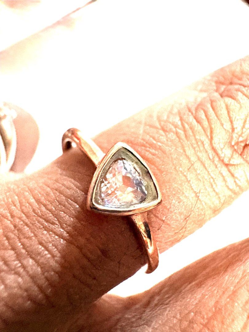Moonstone Ring (Category: Rings) located in Singapore. Submitted by Discoverme (Listing ID 1452940893, Image 3). Description: ✨ Natural Rainbow Moonstone adjustable Ring Elegant triangle-cut moonstone featuring a beautiful blue-purple shimmer (adularescence). Set in a minimalist bezel design, this timeless piece is perfect for everyday wear or as a meaningful gift. * Gemstone: Moonstone (月光石) * Weight: 1.33 g (total item weight, not the stone alo