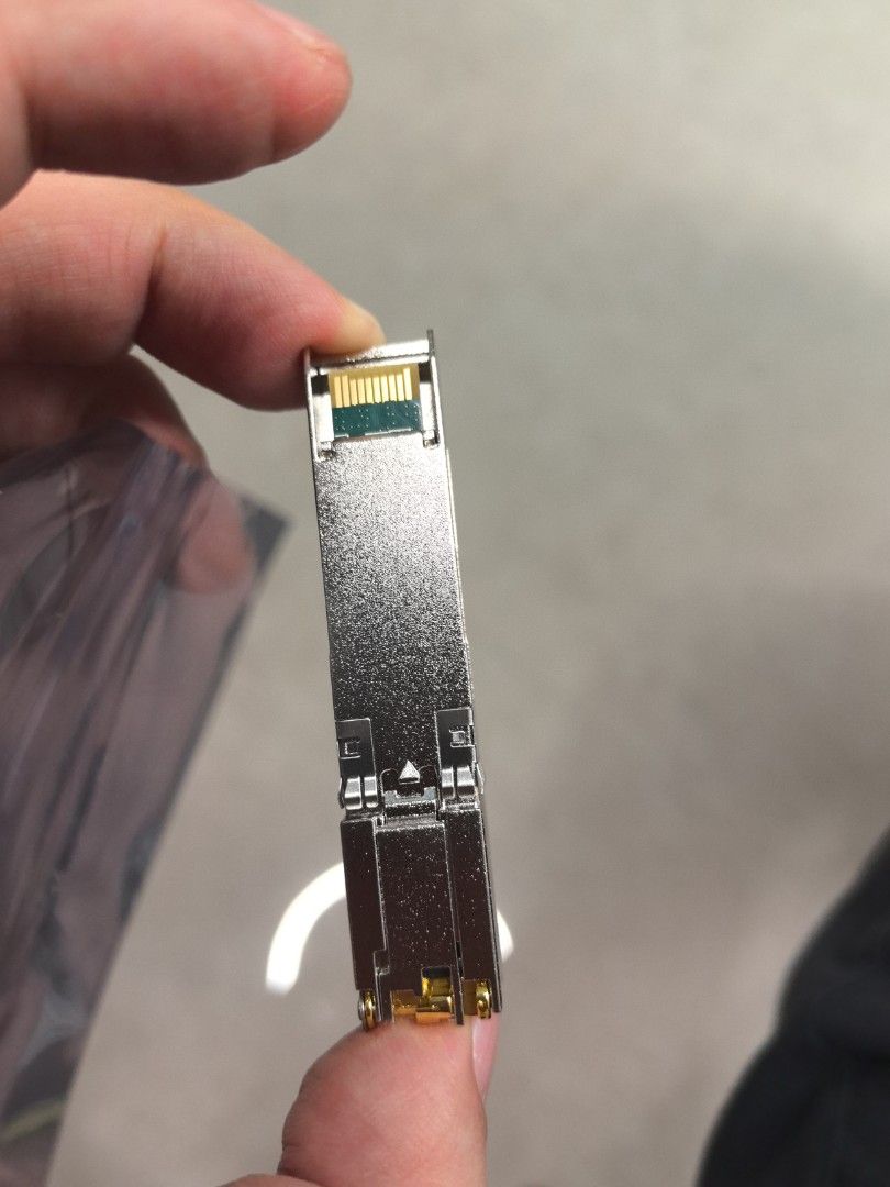 Network Transceiver Module SFP+ (Category: Networking) located in Singapore. Submitted by sgtomx (Listing ID 1452998549, Image 2). Description: - 10G SFP-T network transceiver module - Silver casing with gold connectors - Tested and confirmed working - Ready for immediate deployment.