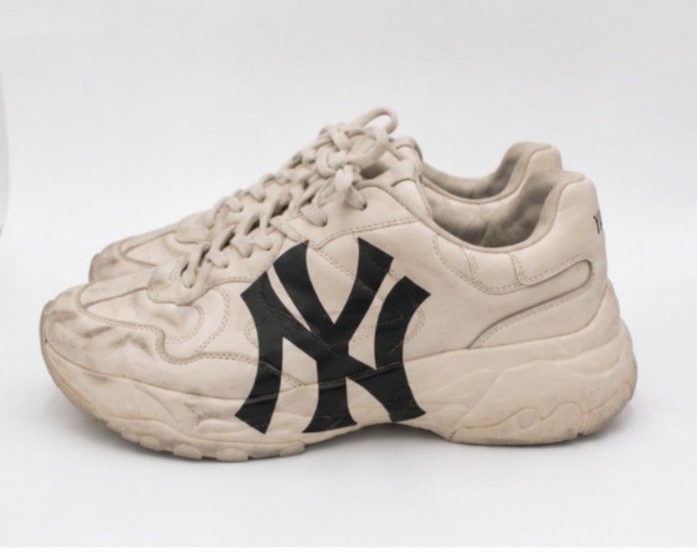 New York Yankees Chunky Sneakers (Category: Sneakers) located in Batangas. Submitted by curatedluxxe88 (Listing ID 1452978841, Image 2). Description: - Cream colored chunky sneakers - Features New York Yankees logo on the side - 'Yankees' printed on the back heel - Thick sole for comfort and style - Perfect for casual everyday wear - Shows some signs of wear, particularly on soles and edges.