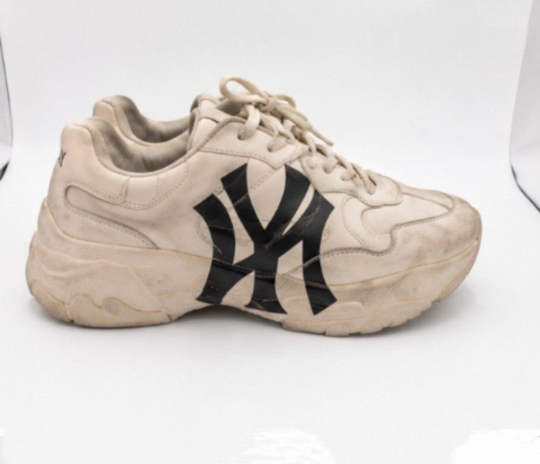 New York Yankees Chunky Sneakers (Category: Sneakers) located in Batangas. Submitted by curatedluxxe88 (Listing ID 1452978841, Image 1). Description: - Cream colored chunky sneakers - Features New York Yankees logo on the side - 'Yankees' printed on the back heel - Thick sole for comfort and style - Perfect for casual everyday wear - Shows some signs of wear, particularly on soles and edges.