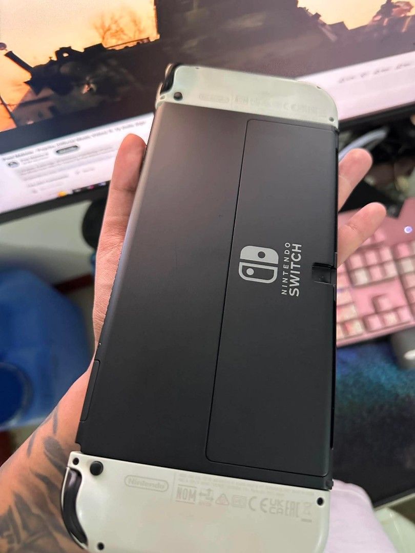 Nintendo Switch oled (Category: Nintendo) located in Manila. Submitted by em_mmmm (Listing ID 1453047017, Image 2). Description: slightly used due to work -charger -dock -skull & co neo grip -carrying case -zelda botw -hogwarts legacy .