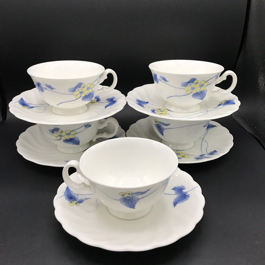 Noritake Studio Collection Teacups and Saucers Set (Category: Coffee & Tea Tableware) located in Baao. Submitted by all.things.japan (Listing ID 1452914886, Image 1). Description: Dimensions: Saucer: 6.0 inches diameter Cup: 4.0 (d) x 2.25 inches - Set of 5 teacups and saucers - Made of white porcelain - Features a charming blue and yellow floral design - Crafted in Japan - Ideal for your morning coffee or afternoon tea - Adds an elegant touch to