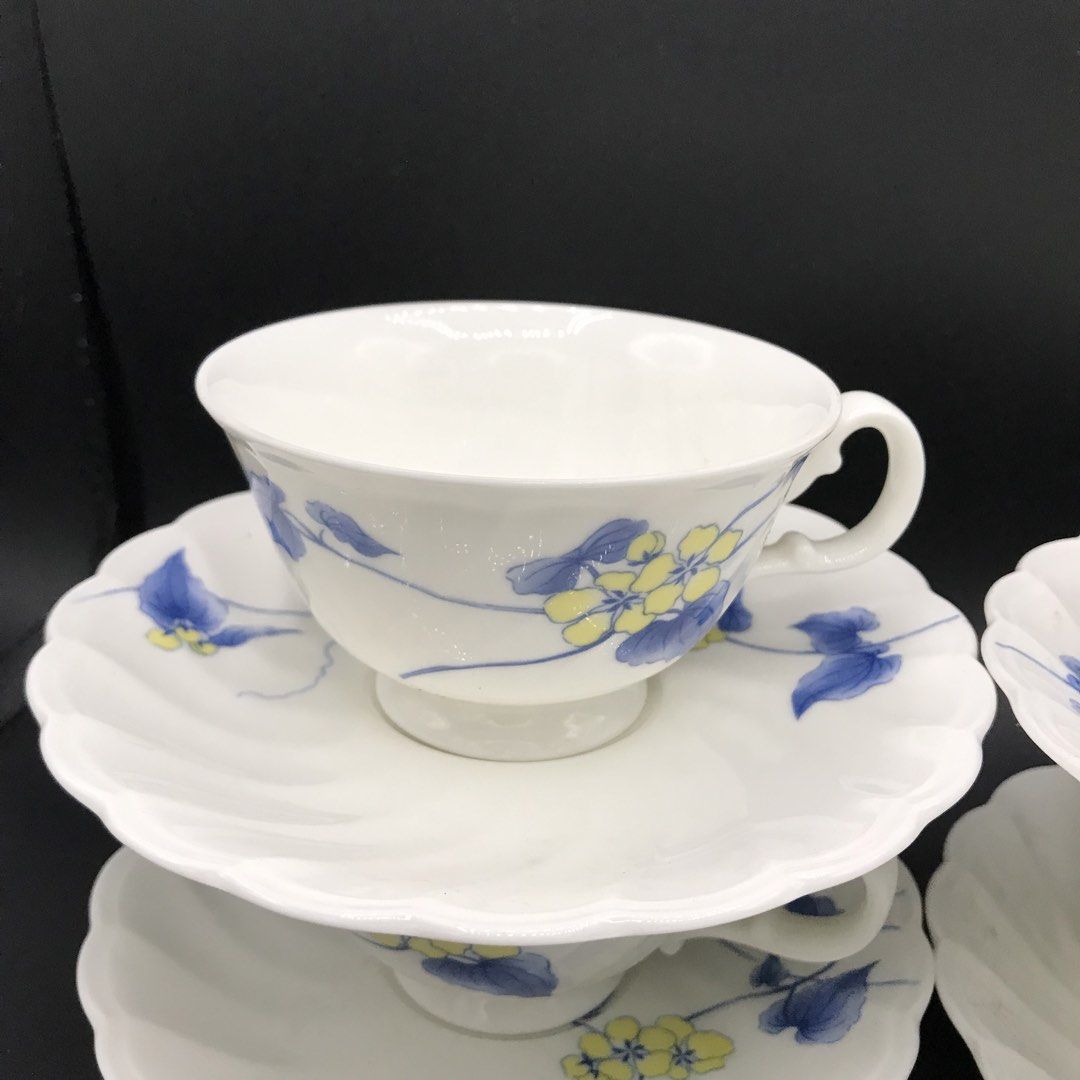 Noritake Studio Collection Teacups and Saucers Set (Category: Coffee & Tea Tableware) located in Baao. Submitted by all.things.japan (Listing ID 1452914886, Image 2). Description: Dimensions: Saucer: 6.0 inches diameter Cup: 4.0 (d) x 2.25 inches - Set of 5 teacups and saucers - Made of white porcelain - Features a charming blue and yellow floral design - Crafted in Japan - Ideal for your morning coffee or afternoon tea - Adds an elegant touch to
