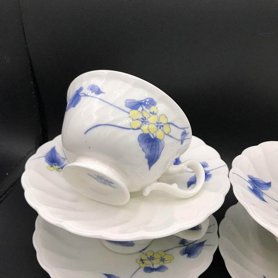 Noritake Studio Collection Teacups and Saucers Set (Category: Coffee & Tea Tableware) located in Baao. Submitted by all.things.japan (Listing ID 1452914886, Image 3). Description: Dimensions: Saucer: 6.0 inches diameter Cup: 4.0 (d) x 2.25 inches - Set of 5 teacups and saucers - Made of white porcelain - Features a charming blue and yellow floral design - Crafted in Japan - Ideal for your morning coffee or afternoon tea - Adds an elegant touch to