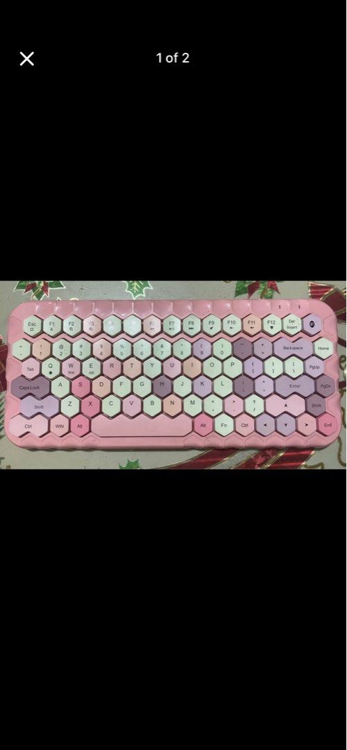 Pink Hexagonal Keycap Wireless Keyboard (Category: Computer Keyboard) located in Quezon City. Submitted by ellie.belly025 (Listing ID 1452971005, Image 1). Description: - Cute pink wireless keyboard - Unique hexagonal keycaps - Works great - Wireless connectivity - Easy to use - Battery compartment on the back - Perfect for upgrading your desk setup.