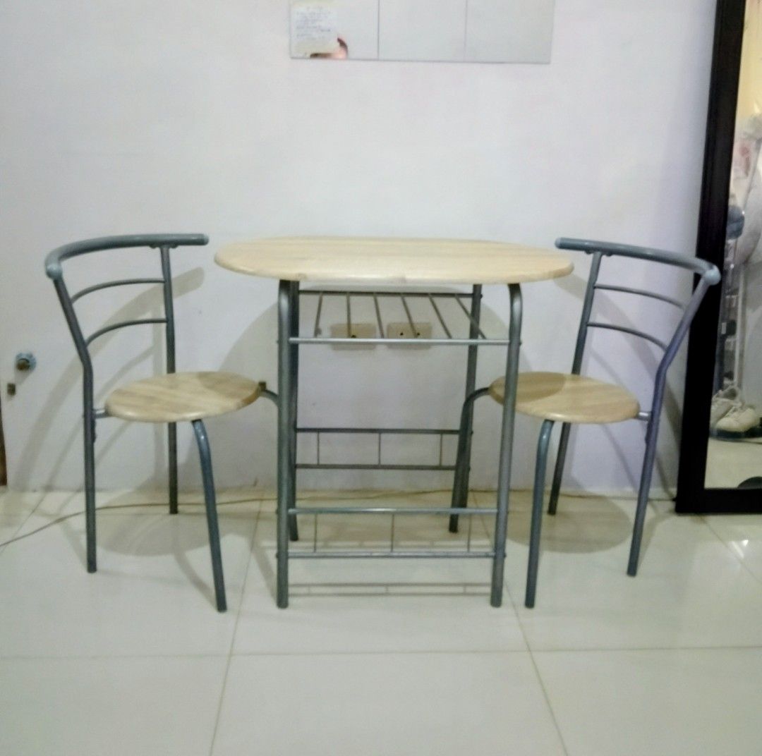 Space-Saving 2-Seater Dining Set (Category: Tables & Sets) located in Makati City. Submitted by foryoufindsph (Listing ID 1452889479, Image 3). Description: ​🪑 Space-Saving 2-Seater Dining Set 💸 Price: ₱2,899 ​Clean, minimal, and ultra-functional! Perfect for condo living, small apartments, or cozy kitchen nooks. ☕✨ ​📌 Highlights: ​Includes: 1 table + 2 Tuck-In chairs ​Frame: Sturdy Powder-Coated Metal ​Top/Seats: Wood-Laminate Finish ​Conditi