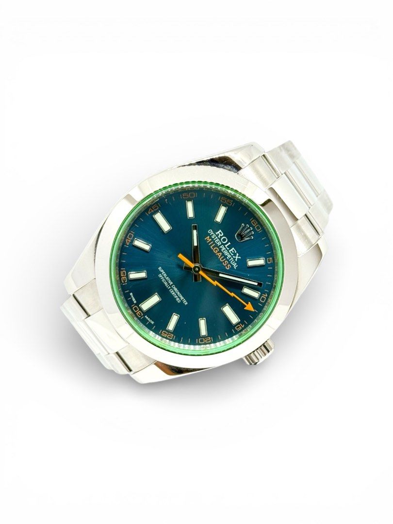 Preowned Rolex Milgauss 116400GV Blue Dial (2014) (Category: Watches) located in Singapore. Submitted by montres.pickering (Listing ID 1452915562, Image 2). Description: Preowned in mint condition. Complete set with box, warranty card and red tag. Warranty dated November 2014. Full service overhaul done with Rolex Centre in 2026. Under international warranty until 2028..