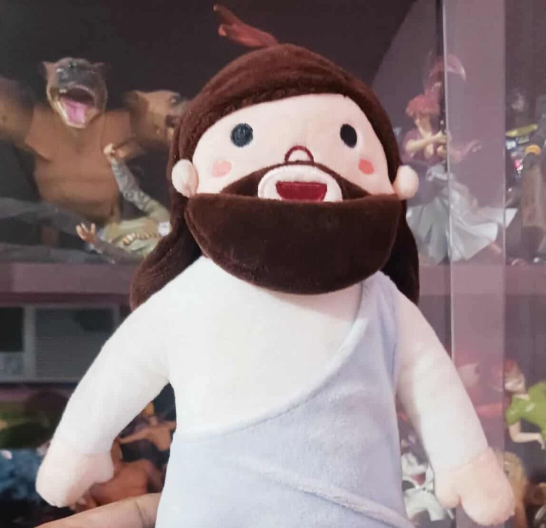 RARE Papa Jesus Plush ( Jesus Christ ) (Category: Vintage Collectibles) located in Manila. Submitted by mickey_salonga (Listing ID 1452958025, Image 1). Description: - Soft plush toy of Jesus - Features brown hair and beard - Wears a light blue robe over a white tunic - Adorable design with rosy cheeks and a smiling mouth - Ideal for display or as a comforting companion.