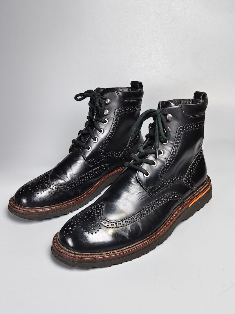 Rockport Wingtip Laceup Boots (Category: Boots) located in Manila. Submitted by kennethc21 (Listing ID 1453015629, Image 1). Description: Rockport Wingtip Laceup Boots Size: 10M US / 9.5UK/ 44 EURO/ 28CM Condition: Excellent Issue: None ▪️Premium full-grain black leather upper ▪️ Classic wingtip and brogue detailing ▪️High-top lace-up design with metal eyelets & speed hooks ▪️ Durable, slip-resistant sport-inspired outsole ▪️Comfortable for casua