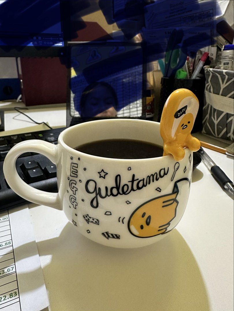 Sanrio Gudetama Mug and Spoon Set '22 (Category: Dinnerware & Cutlery) located in Baguio. Submitted by gayecee (Listing ID 1452907890, Image 1). Description: - Adorable Gudetama mug with all-over designs. - Includes a matching spoon with Gudetama's face on the handle. - Ideal for coffee, tea, or as a gift for Gudetama fans. - Authentic Sanrio product from 2022..