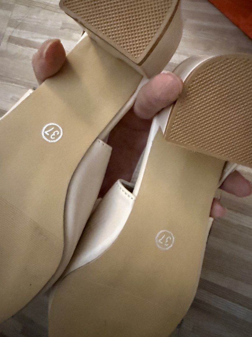 S&L Slingback Heels Sandals Work Office Size 37 (Category: Heels) located in Quezon City. Submitted by macey_store (Listing ID 1452948105, Image 3). Description: - Cream slingback heels - Pointed toe design - Adjustable strap with buckle closure - Comfortable block heel - Size 37 - Perfect for dressing up or down.