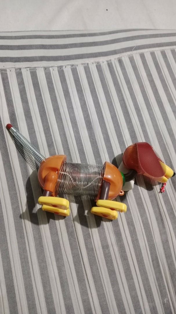 Slinky Dog Junior Pull Toy from Toy Story (Category: Kids Toys) located in Manila. Submitted by secrettoys (Listing ID 1452974136, Image 1). Description: - Classic Slinky Dog Junior pull toy - Inspired by Disney's Toy Story - Interactive toy with a springy body for fun movement - Comes in original packaging - Great addition to any toy collection.