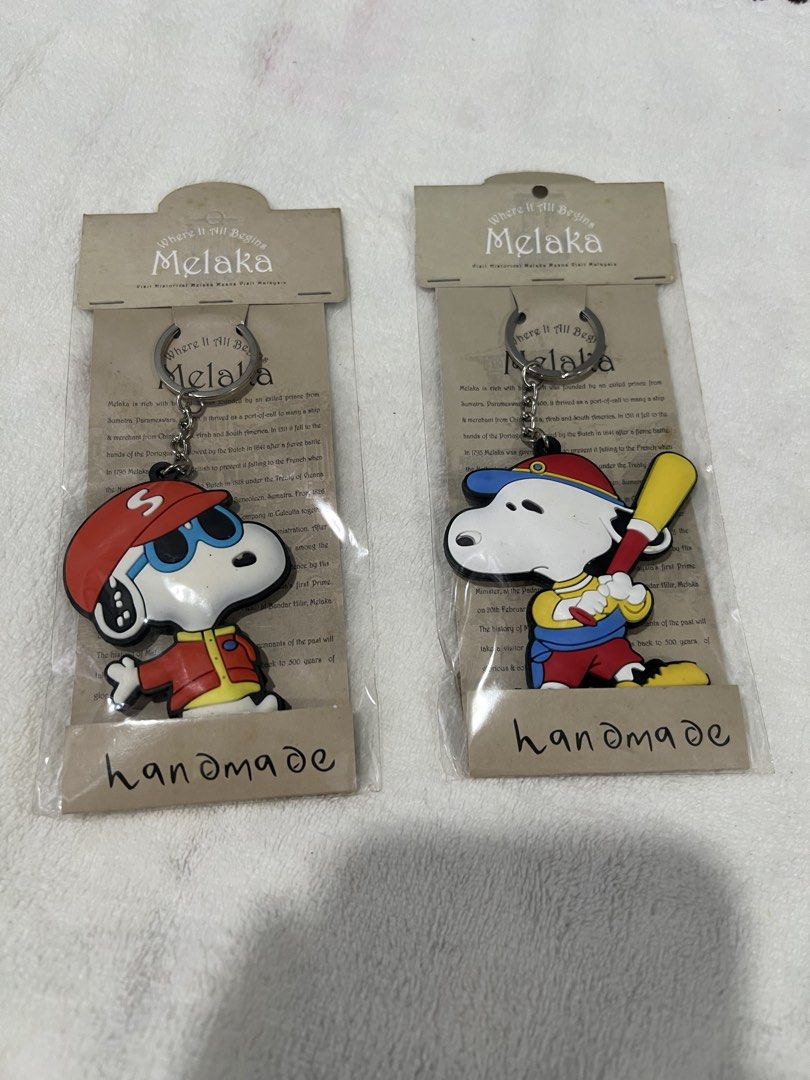 Snoopy Keychains (Category: Character Goods) located in Singapore. Submitted by morado_storee (Listing ID 1452985705, Image 3). Description: Snoopy keychains Includes various Snoopy designs (red strap, headphones, Melaka special edition) $1 each.