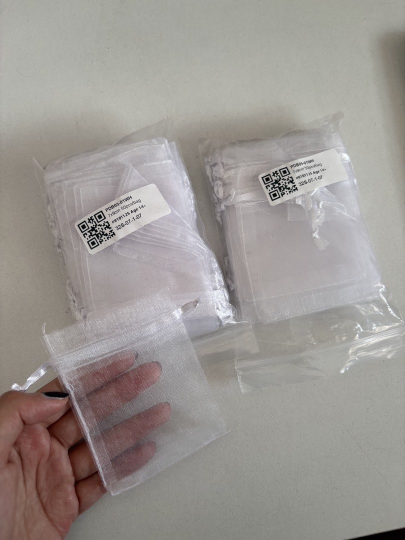 Tiny drawstring packaging 7x9cm (Category: Craft Supplies & Tools) located in Singapore. Submitted by eejlnry (Listing ID 1452904421, Image 1). Description: clearing stuff from my flower business size: 7x9cm quantity: i think i have at least 60 here material: Sheer organza perfect for jewelry, small gifts, party favors, and crafts.