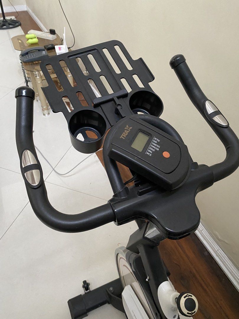 TRAX BEAT Spin Bike Exercise Bike (Category: Cardio & Fitness Machines) located in Makati City. Submitted by margascloset (Listing ID 1452940759, Image 2). Description: - TRAX BEAT Spin Bike - Perfect for home workouts - Adjustable seat and handlebars for a customized fit - Digital display to monitor your workout progress - Built-in cup holder - Integrated phone/tablet stand - negotiable.