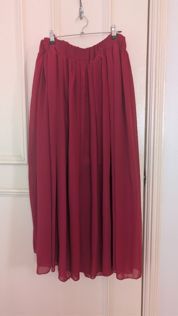 Unbranded Maroon Chiffon Maxi Skirt (Category: Skirts) located in Las Pinas. Submitted by decluttering.taurus (Listing ID 1452925666, Image 1). Description: LAST PRICE POSTED! Flowy maroon maxi skirt with an elastic waistband and inner lining. Elegant, comfortable, and easy to dress up or down. Size: Free size; waist approximately 12–13 inches laid flat, stretchable Length: Approximately 33–34 inches RFS: Not my style anymore Payment: BPI / GCash