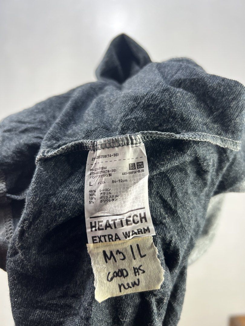Uniqlo Heattech Extra Warm Turtleneck Top Grey L (Category: Longsleeves) located in Baguio. Submitted by trenchcoats.ph (Listing ID 1452986706, Image 2). Description: - Uniqlo Heattech Extra Warm turtleneck top - Size: L - Color: Grey - Sleeve Length: Long sleeves - Material: Rayon, Acrylic, Polyester, Polyurethane - Features: Extra warm, ideal for layering in colder weather, comfortable, and functional..