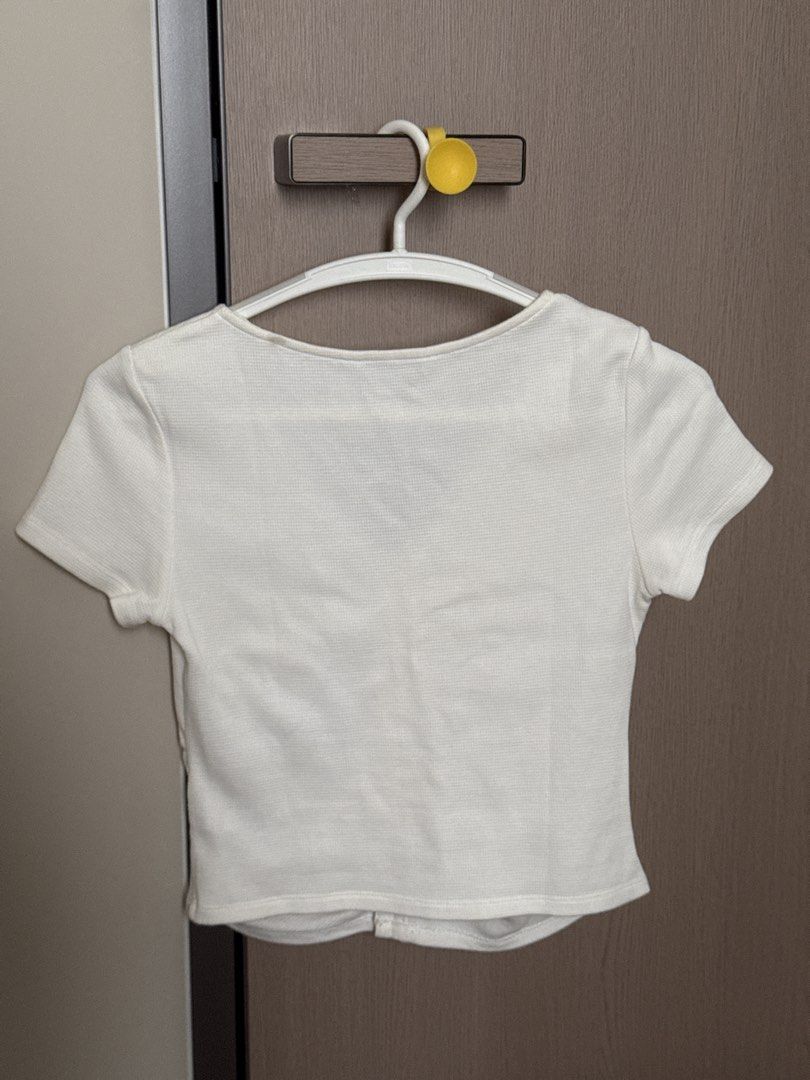 Urban Revivo White Ruched Top (Category: Blouses) located in Manila. Submitted by je2ny (Listing ID 1431942582, Image 3). Description: RFS: Decluttering Bust: 38cm Top Length: 46cm Arm Hole: 13cm - Urban Revivo white top - V-neck design - Short sleeves - Ruched front with button details.