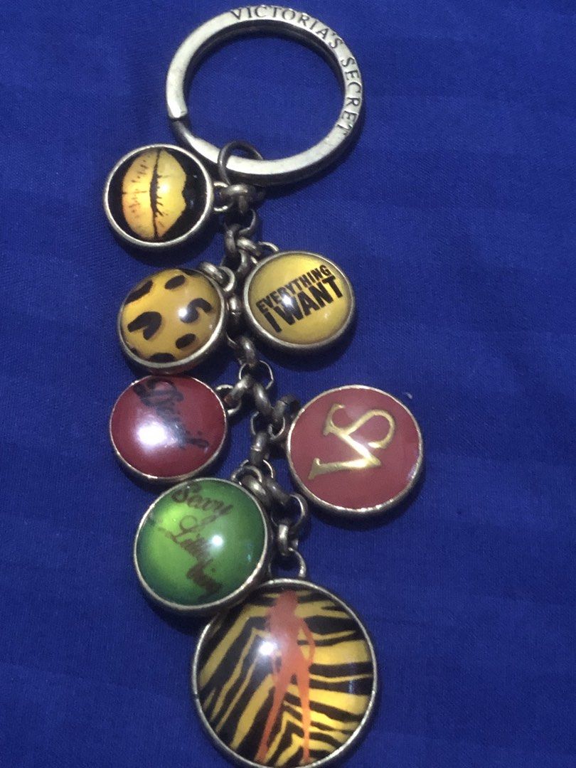 Victoria's Secret BAG CHARMS (Category: Other Accessories) located in Quezon City. Submitted by unique2shop (Listing ID 1452954463, Image 3). Description: - Authentic Victoria's Secret keychain - Features multiple charms with iconic VS sayings: 'Love Victoria's Secret', 'And Nothing I Need', 'Everything I Want', 'Angel', 'Sexy Little Thing' - Includes stylish leopard print and tiger stripe charms with silhouette - Versatile accessory for your key