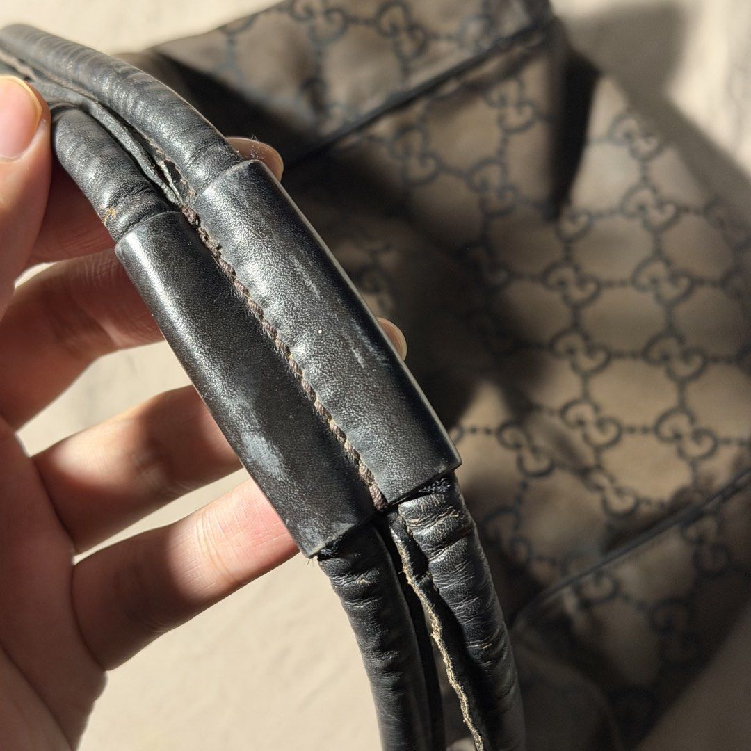 VINTAGE GUCCI MONOGRAM NYLON SHOULDER BAG (Category: Luxury Bags & Wallets) located in Lubao. Submitted by the_elusive_shop (Listing ID 1453020054, Image 3). Description: 100% AUTHENTIC VINTAGE GUCCI DARK BROWN GG MONOGRAM BAG Condition: Good vintage condition with normal signs of wear for its age. The leather zipper pull/strap is no longer attached but the zipper itself still works fine. Please check all photos for the overall condition. NOTE: N
