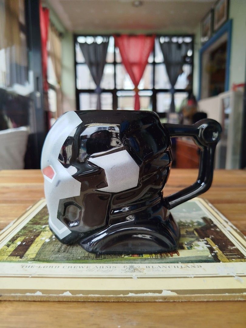 War Machine Iron Man Helmet Mug (Category: Coffee & Tea Tableware) located in Makati City. Submitted by meowmyella (Listing ID 1453002810, Image 2). Description: - Black Ironman 3D ceramic mug - Perfect for any Marvel fan. - Features a sturdy handle for easy grip. - Unique and eye-catching design. - A fun addition to your kitchenware collection..