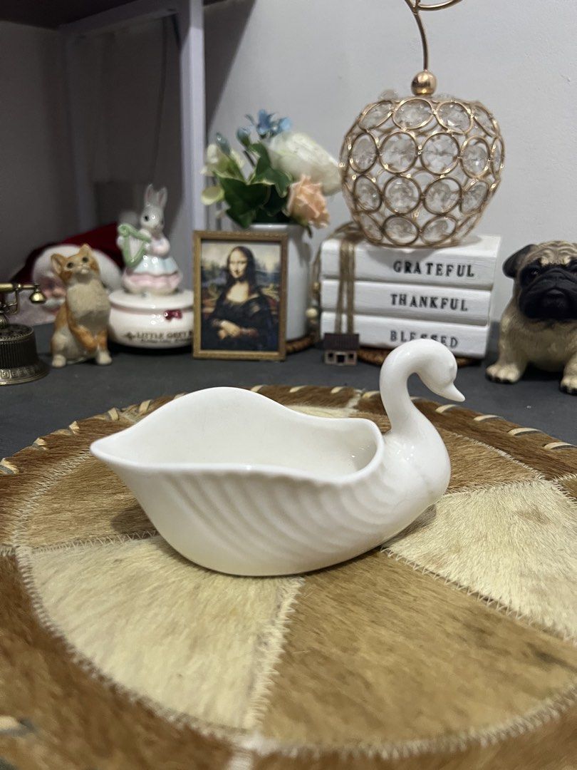 White Ceramic Swan Serving Dish (Category: Dinnerware & Cutlery) located in Las Pinas. Submitted by maple0305 (Listing ID 1452982975, Image 3). Description: - Adorable white ceramic swan dish - Ideal for serving sauces or small snacks - Adds a charming touch to any table setting - Approximate dimensions: [insert length] by [insert width].