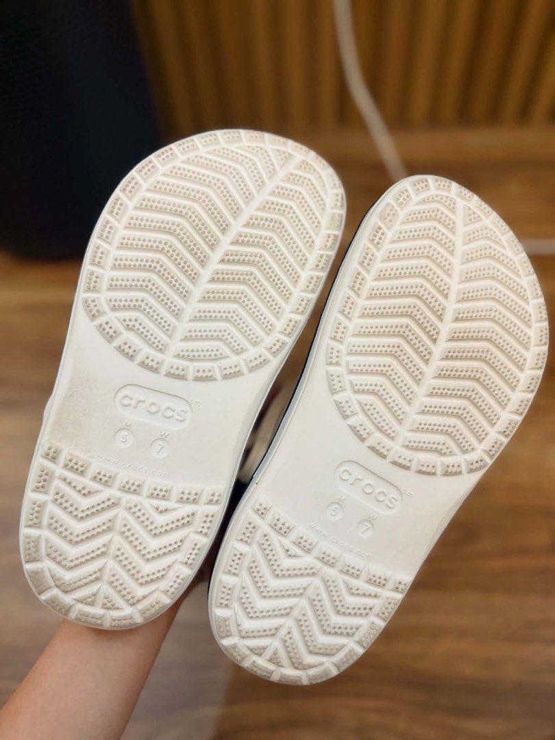 White Crocs Clogs with Navy black Trim (Category: Slippers and slides) located in Las Pinas. Submitted by yuiiiieee (Listing ID 1452901496, Image 2). Description: - Classic white Crocs clogs - Features iconic Crocs logo - black trim around the sole -Bought in japan -size 37 -Selling for 2k .