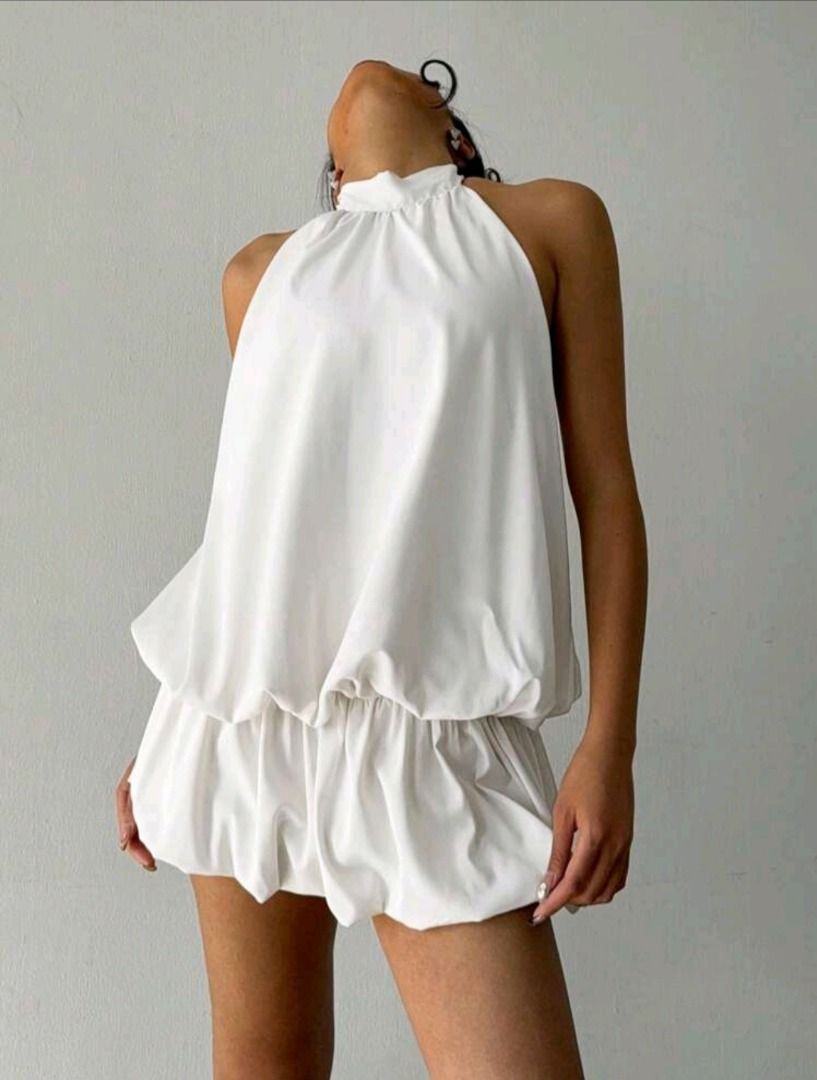 White Halter Neck Bubble Hem Mini Dress (Category: Dresses) located in Quezon City. Submitted by revivingstuff (Listing ID 1452940735, Image 1). Description: - Cute white halter neck dress - Features a gathered bubble hem - Open back with tie closure - Lightweight and flowy fabric - Ideal for parties or a night out - Effortlessly chic style Brand new, never worn RFS: no longer needed Last price posted .