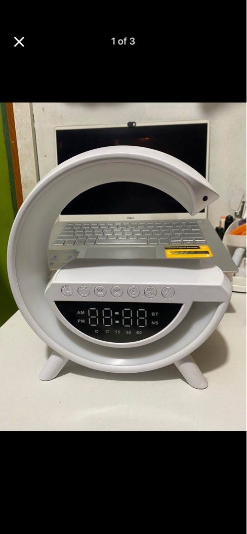White Sunrise Wake-Up Light Alarm Clock with Bluetooth Speaker (Category: Clocks) located in Quezon City. Submitted by ellie.belly025 (Listing ID 1452970801, Image 1). Description: - Sunrise simulation: Gradually brightens to wake you up naturally. - Bluetooth speaker: Enjoy music or podcasts from your phone. - Time display: Clearly shows the current time. - Timer settings: Convenient for various uses. - Unique white crescent moon design: Adds a 