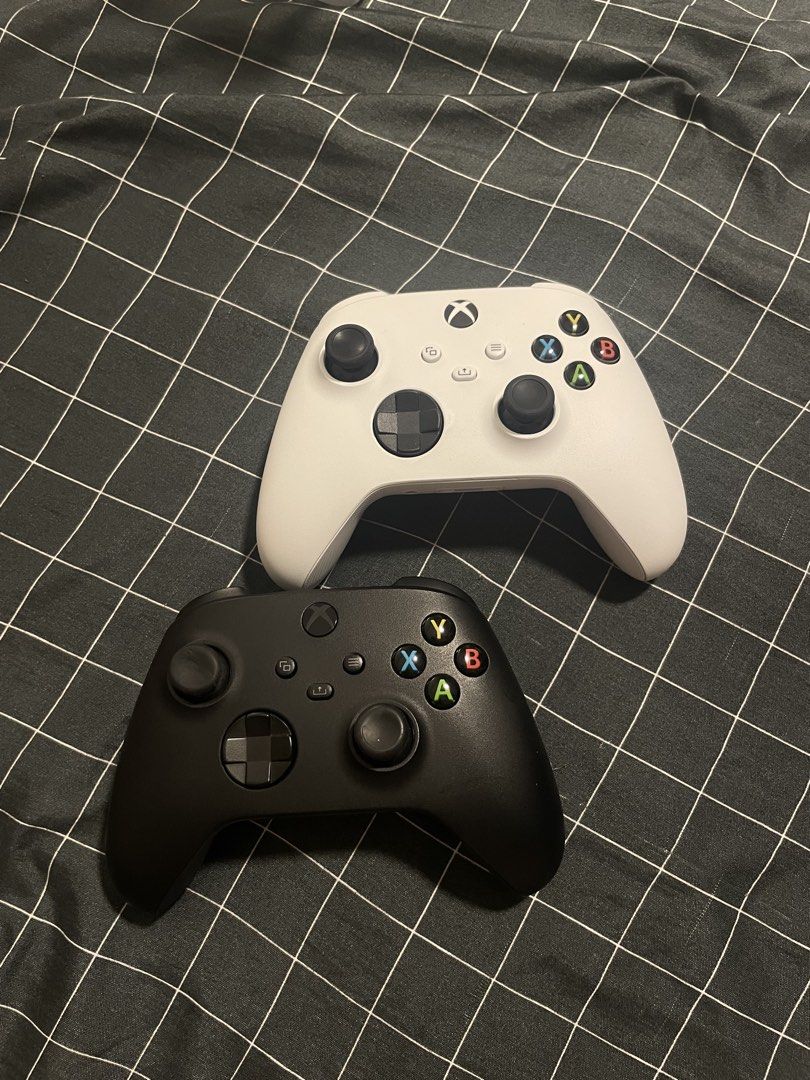 Wireless Xbox controller (Category: Controllers) located in Singapore. Submitted by kur0cat (Listing ID 1452899262, Image 1). Description: Compatible with Xbox Series S/X, Xbox One X, Xbox One S, Xbox One, Windows 10 White: SOLD Black: Used often, $40 Please scroll for thumbstick condition on the black controller .