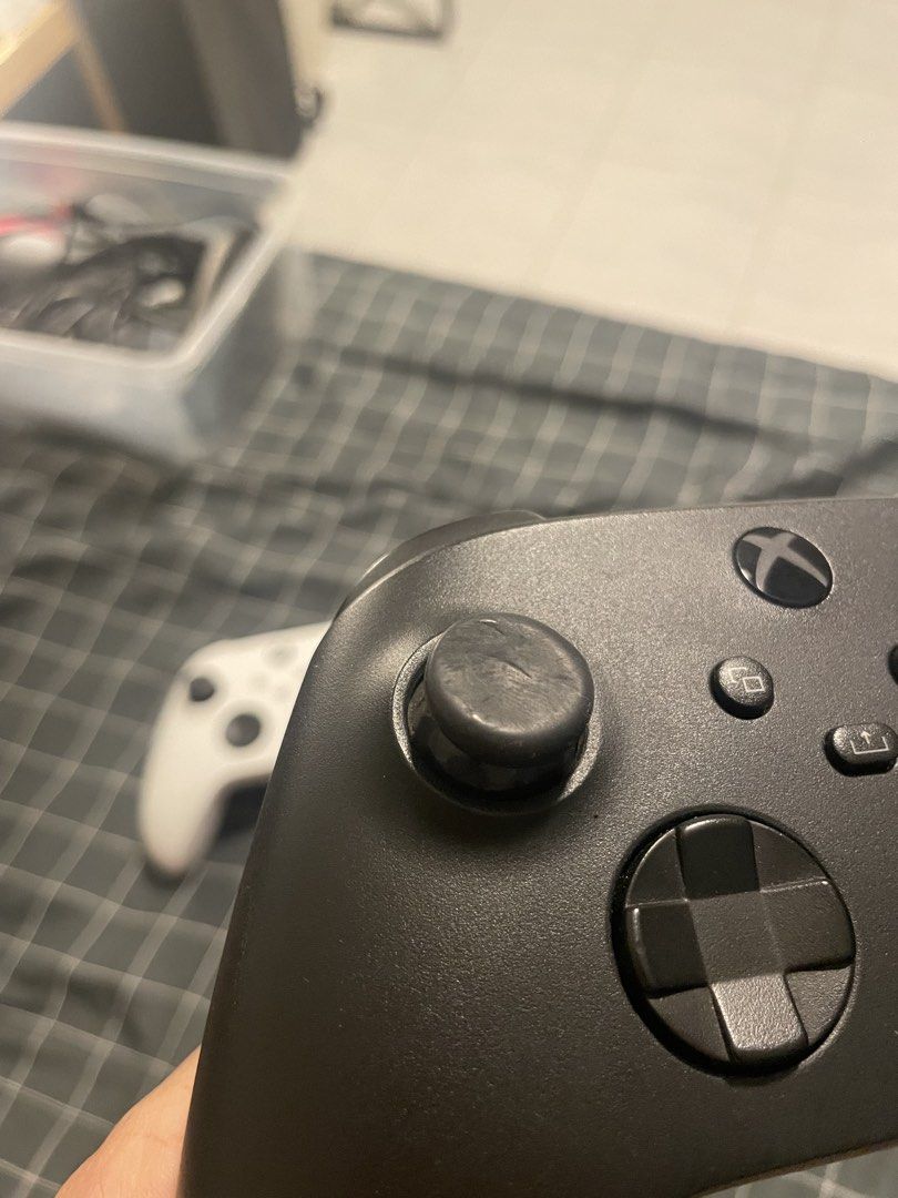 Wireless Xbox controller (Category: Controllers) located in Singapore. Submitted by kur0cat (Listing ID 1452899262, Image 3). Description: Compatible with Xbox Series S/X, Xbox One X, Xbox One S, Xbox One, Windows 10 White: SOLD Black: Used often, $40 Please scroll for thumbstick condition on the black controller .