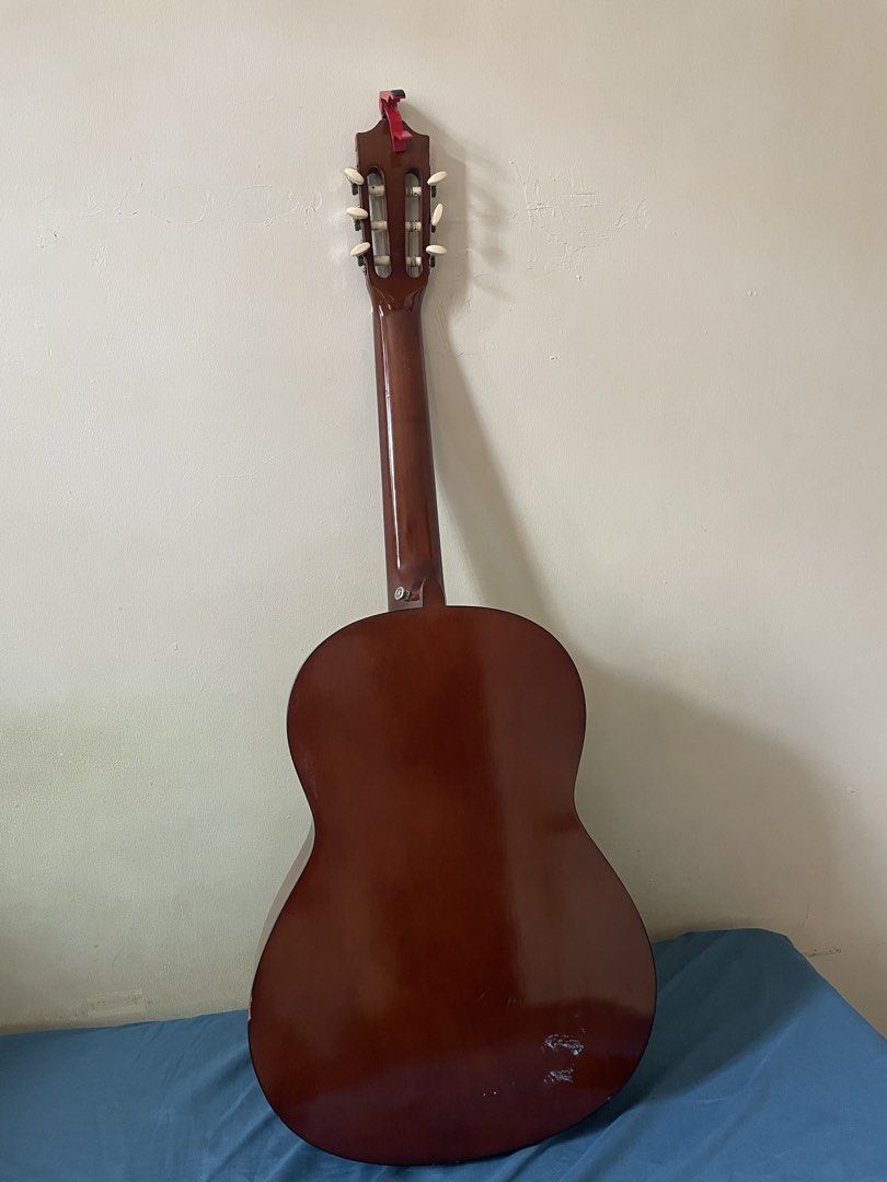 Yamaha C40 Classic Guitar (Negotiable) (Category: Musical Instruments) located in Bulacan. Submitted by thenasofia_ (Listing ID 1452922348, Image 2). Description: Selling our original Yamaha C40 classical guitar. The guitar is in good playing condition with no functional issues. It has normal cosmetic signs of use such as minor scratches and paint chips from age, but there are no cracks or structural damage. The original gig bag is included for f
