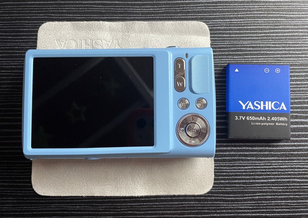 Yashica x Peanuts Snoopy Digital Camera / Digicam (Blue Sky) (Category: Cameras) located in Quezon City. Submitted by erinp123 (Listing ID 1453016462, Image 3). Description: - Only used once for testing - With original box - All inclusions complete: Charger cord, Battery, Pouch case, Microfiber cloth, Lanyard, Stickers, Keychain (top part broken) - Sample photos included above - Fixed price, non-negotiable (original price was around ₱6500+) .