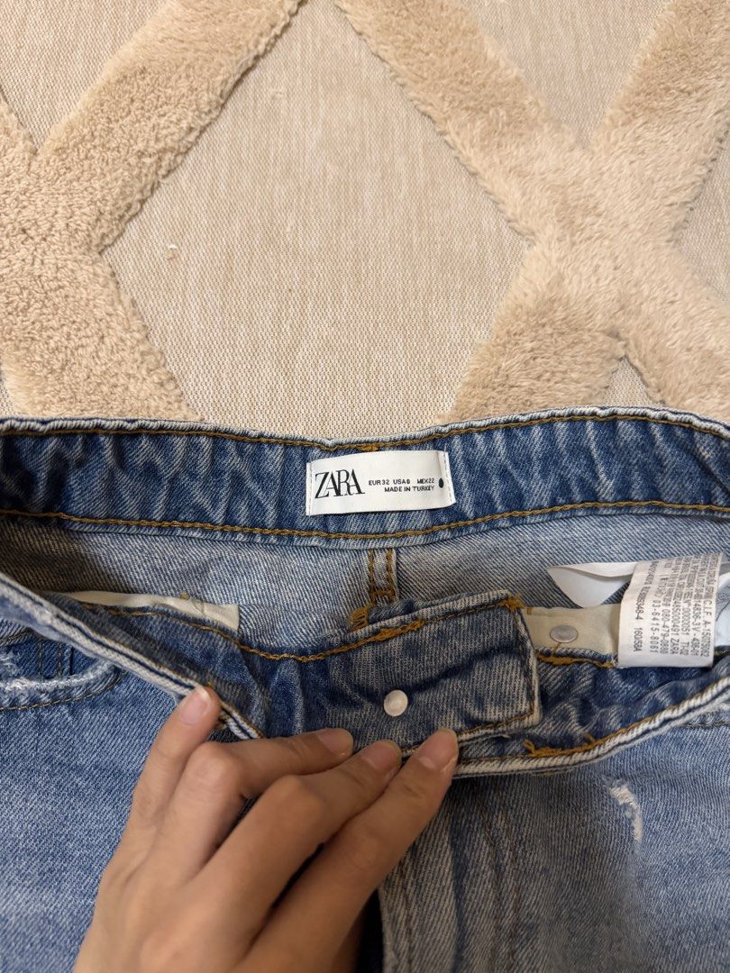 Zara Denim Ripped Shorts (Category: Shorts) located in Bacoor. Submitted by conclaseph (Listing ID 1452891837, Image 2). Description: - Zara Blue Denim Shorts - High-waisted style - Distressed details - Frayed hem - Button and zip closure - Made in Turkey - Ideal for casual wear.