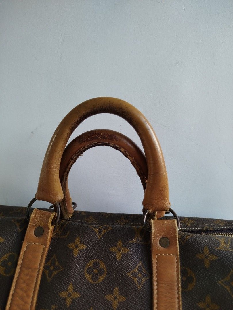 1970's Louis Vuitton Monogram Keepall 45 (Category: Luxury Bags & Wallets) located in Lucena. Submitted by 4301thriftklub (Listing ID 1447504776, Image 3). Description: Louis Vuitton 1970's The French Company Monogram Keepall 45 Circa 1970 Size: 45 Monogram Canvas Tucky at the end Tan Cured Leather Talon Zipper replaced to YKK Manufactured in the USA under licence to The French Company Length: 18" Height: 10" Strap Drop: 5" In 1976 Louis Vuitton 