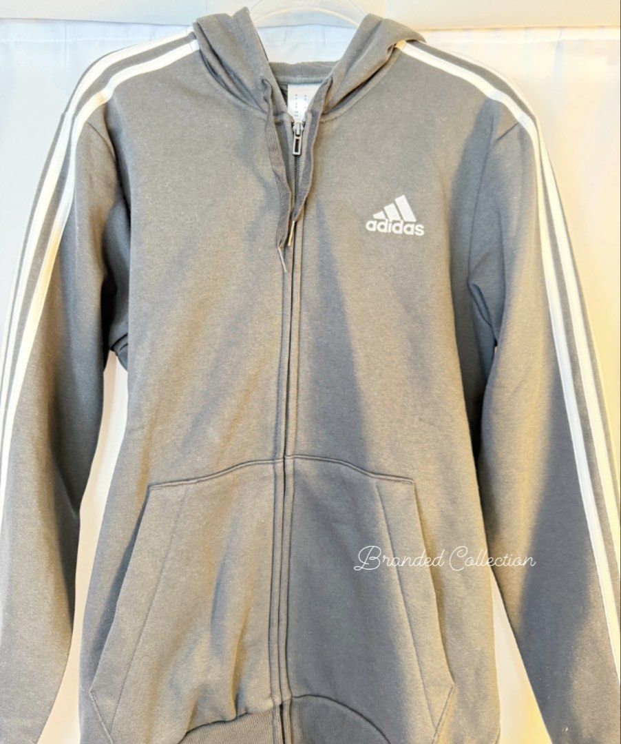 Adidas 3-Stripes Full Zip Hoodie (Category: Coats, Jackets and Outerwear) located in Manila. Submitted by usbrandedcollections (Listing ID 1447472907, Image 2). Description: Adidas SKU: CLT-ADS-0007 (S) SKU: CLT-ADS-0009 (M) Essentials Fleece 3-stripes Full zip Hoodie in Black. Regular Fit. Fullzip with Drawcord adjustable hood. 53% cotton, 36% polyester, 11% viscose. Ribbed cuffs and hem. Size: S & L 🚢 Sea Cargo It takes 3-4 mos for those who a